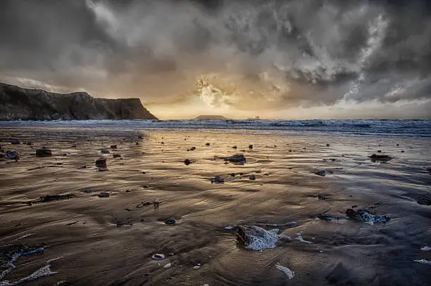 Dramatic weather at Rhossili Bay and Worms Head on the Gower peninsula, South Wales