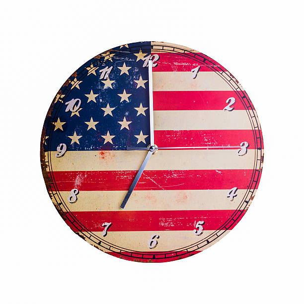 istock retro clock face on American Flag background 517677284
