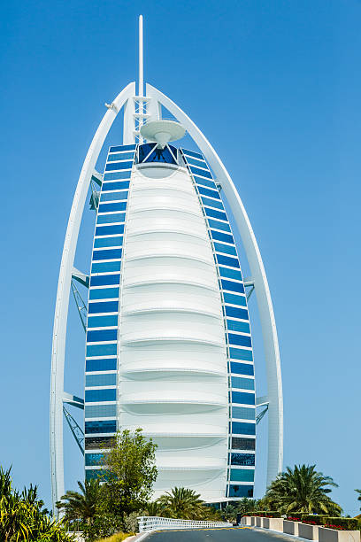 Dubai, United Arab Emirates - April 30, 2014: A world famous sail shaped 7 star hotel Burj Al Arab located at Jumeirah beach, Dubai, United Arab Emirates. Hotel was opened in December 1999.