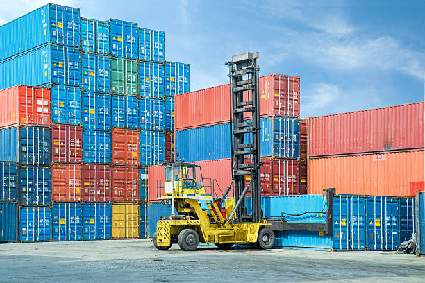 istock Crane lifter handling container box loading to depot 517677681