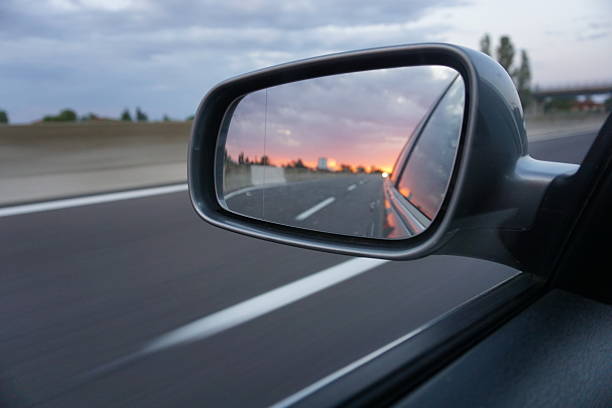 istock Beautiful sunset in a car side mirror on highway 517678205