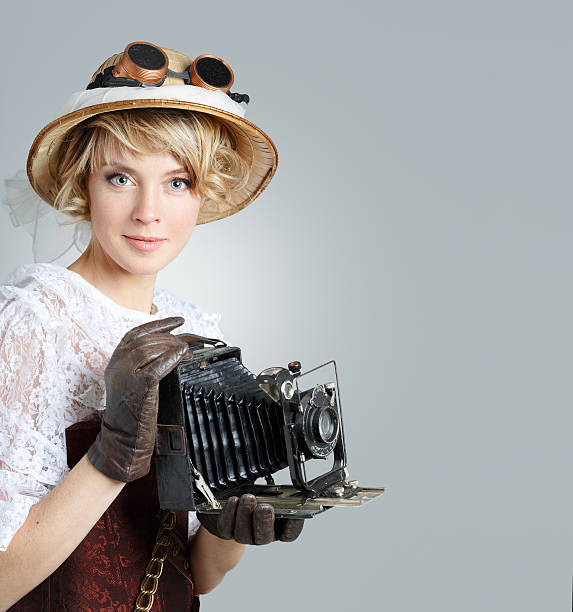 istock Beautiful happy woman with retro camera. 517678563
