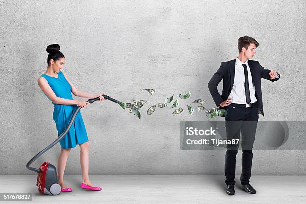 Woman Vacuuming Money Out Of Mans Pocket Stock Photo - Download Image Now - Currency, Humor, Removing