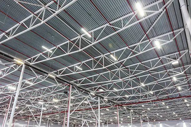 Photo of ceiling lamps with diode lighting in a modern warehouse