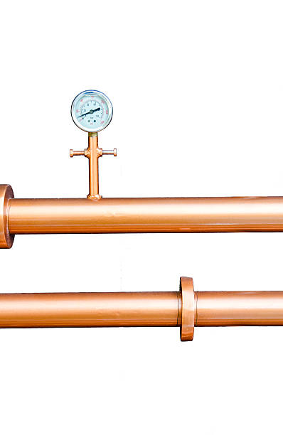 istock Pressure gauge meter on copper pipes on white background. 517679900