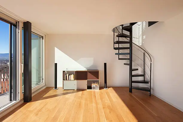 Interior, wide open space of a duplex, parquet floor