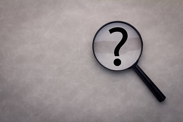 istock magnifying glass and a question mark on the leather 517681886