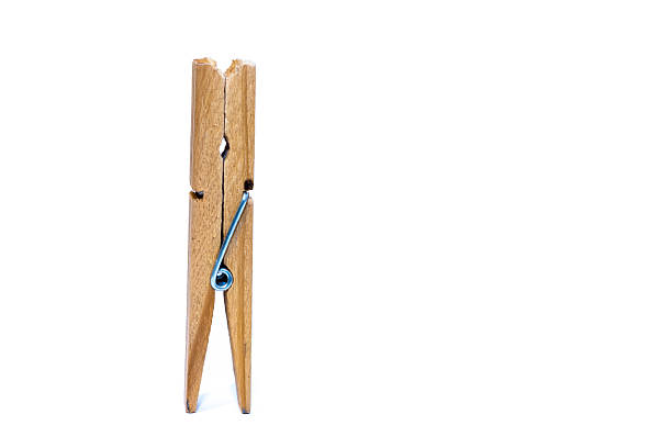 istock One standing wooden clip isolated on white background 517681916