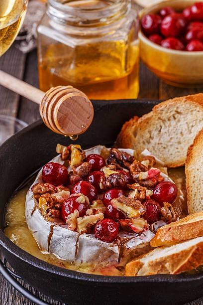 istock Homemade baked brie with honey, cranberry and walnut. 517683074