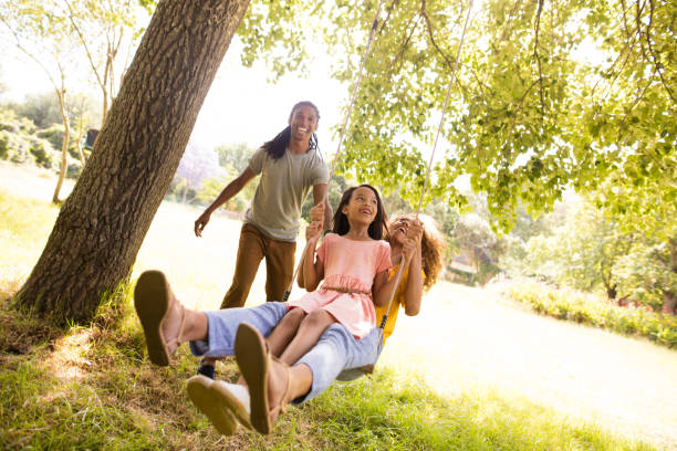 istock Stunning young mom and dad pushing their beautiful daughter 517684810