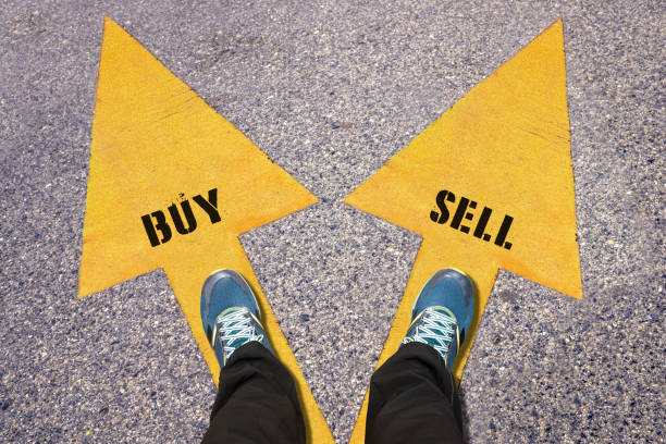 istock Buy and Sell  painted on road 517685884