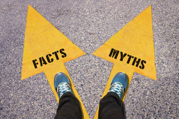 istock Facts and Myths painted on road 517686382