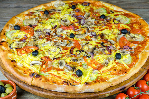 istock Big delicious pizza on an old table 517687790