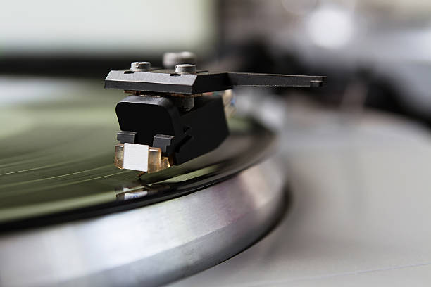 istock Turntable playing vinyl record with music 517688128