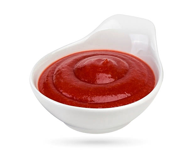 istock Ketchup in bowl isolated on white background. 517688522