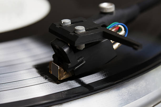 istock Turntable playing vinyl record with music 517688650