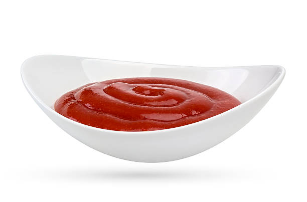 istock Bowl of ketchup isolated on white background. 517688668