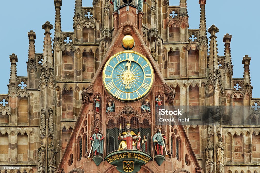 twelve o clock - Frauenkirche in Nuremberg with famous carillion clock of the famous Frauenkirche in Nuremberg, Germany, Bavaria with carillion and mechanical figures - called Maennleinlaufen. Nuremberg Stock Photo