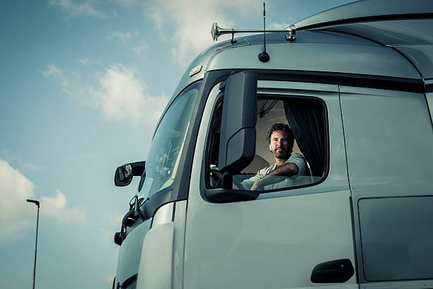 istock Truck Driver Sitting In Cab 517694207