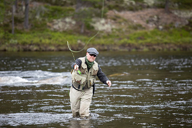 istock Fisherman put the fly line towards viewer 517694789