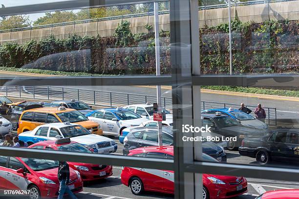 View Of The Taxi Line Out An Airport Window Stock Photo - Download Image Now - Airport, Apron, Commercial Airplane