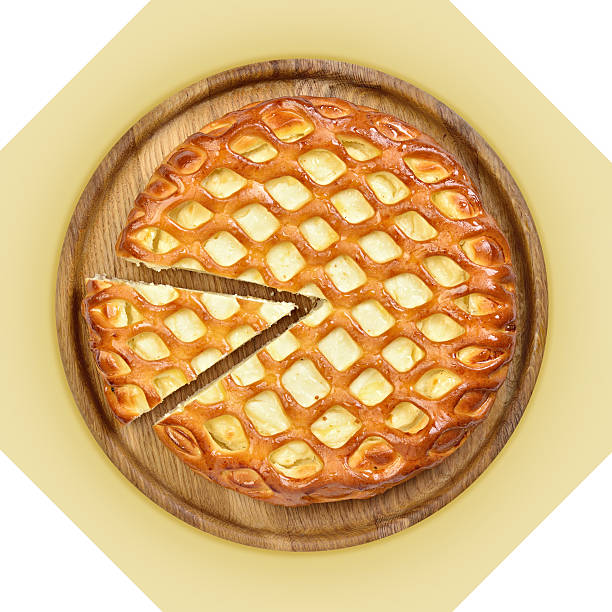 istock Wooden dish of cheese pie with one cut piece. 517697455