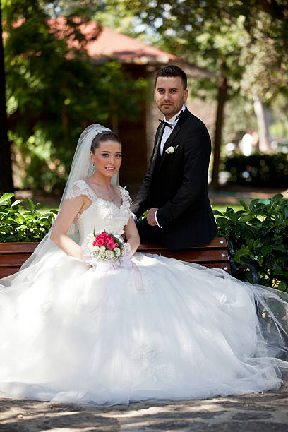 istock bride and groom in garden 517698297