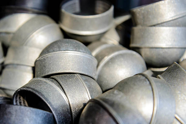 istock supply of shiny new silver chainlink fence post caps 517698857