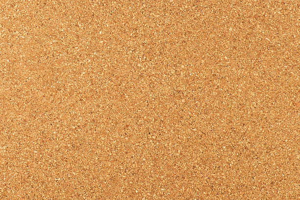 Corkboard Texture Close-up studio shot of cork board texture as background. cork material stock pictures, royalty-free photos & images