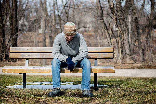 A hobo expresses himself on a bench