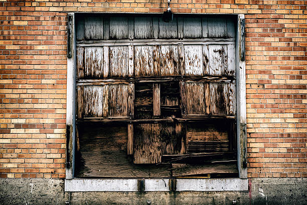 istock Derelict wooden door with peeling white paint 517706028