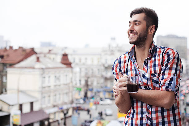 istock Cheerful guy is feasting his eyes upon town 517707226