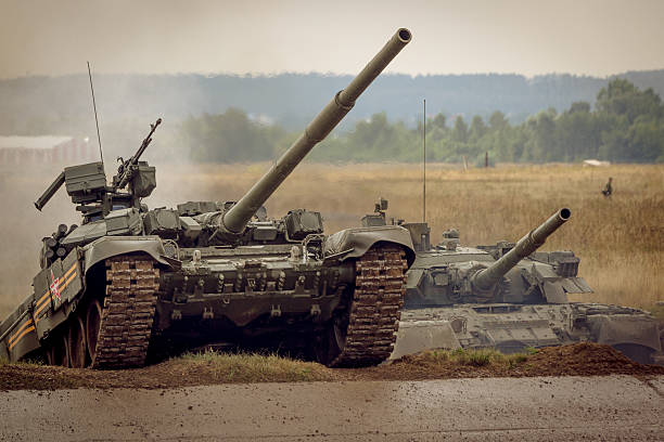 istock two Russian T-90 tank on military range 517710715