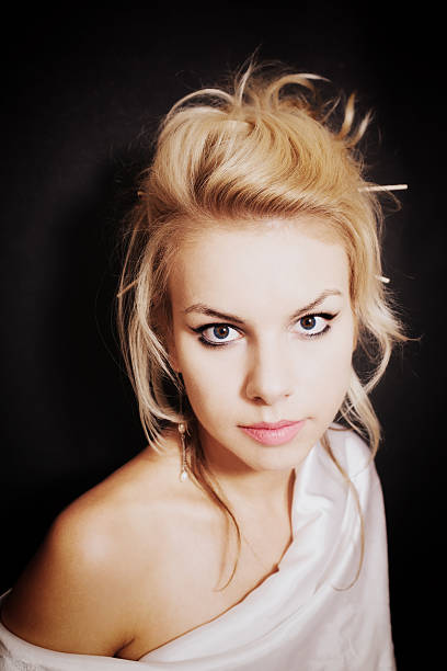 istock Young blonde woman with beautiful hairstyle 517710941