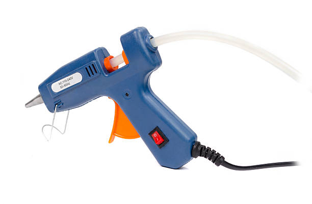 istock Blue glue gun on a white background. 517711287