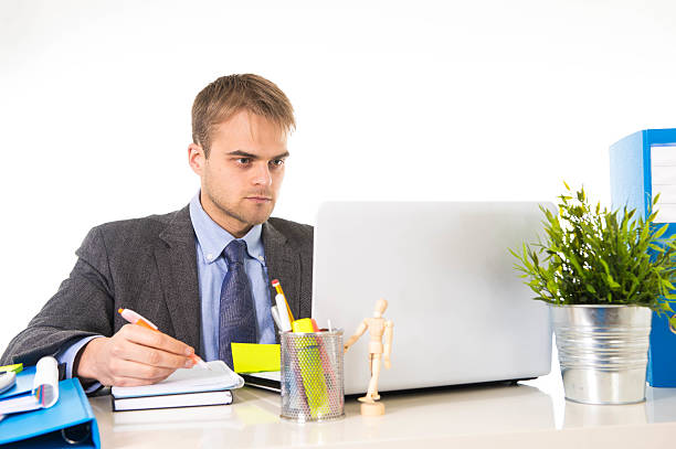 istock attractive businessman working busy with laptop computer in office 517711370