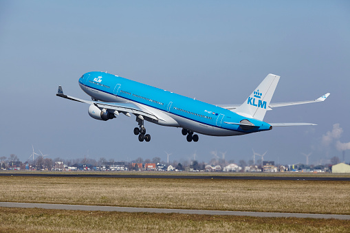 Amsterdam, The Netherlands - March 13, 2016: The KLM Airbus A330-303 with identification PH-AKF takes off at Amsterdam Airport Schiphol (The Netherlands, AMS), Polderbaan on March 13, 2016.