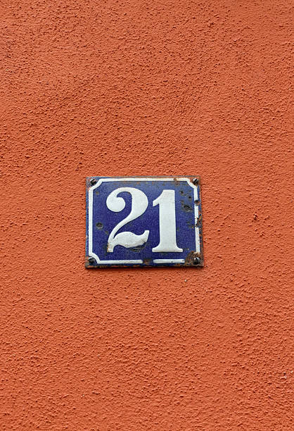 istock House number 21 on old-fashioned blue enamel sign 517712042