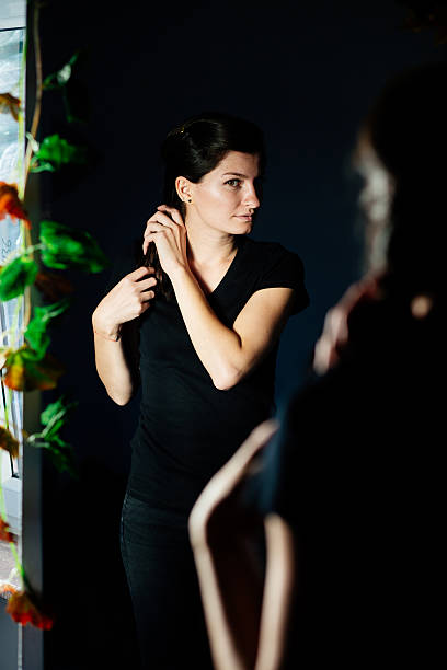 istock Woman looking in the mirror 517712592