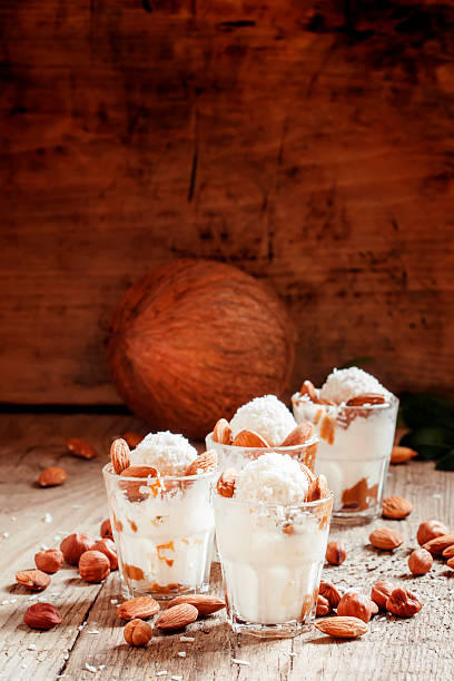 istock Ice cream with peanut sauce, hazelnuts and almonds 517714300