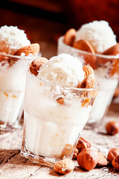 istock Ice cream with peanut sauce, hazelnuts and almonds 517714328