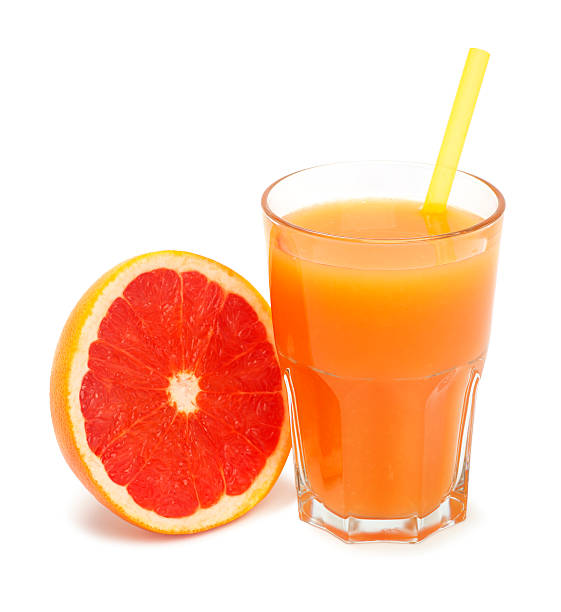 istock glass of freshly pressed grapefruit juice isolated 517714356