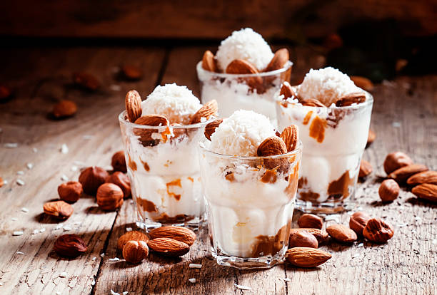 Ice cream with peanut sauce, hazelnuts and almonds