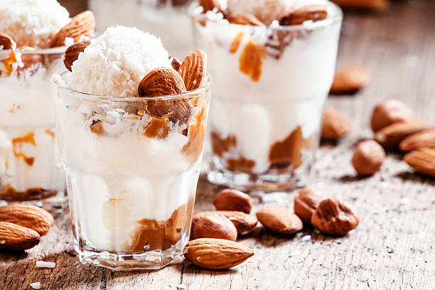 istock Ice cream with peanut sauce, hazelnuts and almonds 517714456