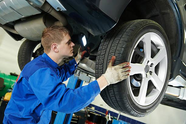 istock auto mechanic at car brake shoes eximining 517722579