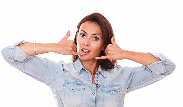 istock Friendly adult brunette with phone gesture 517722823