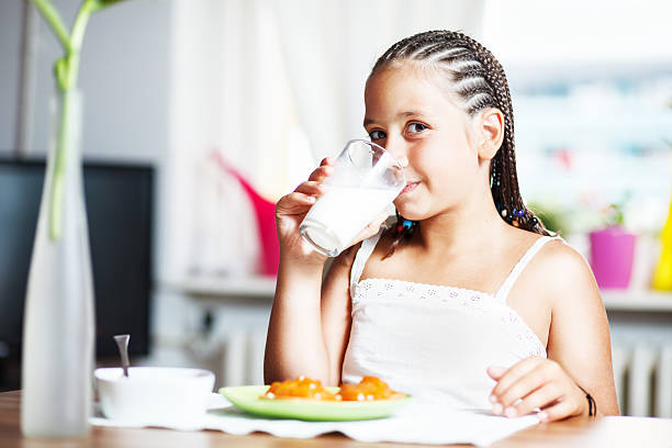 istock Young girl drinking milk 517724269