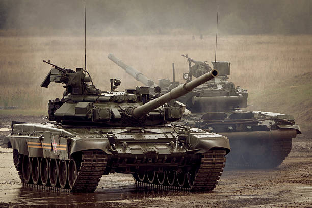 istock two Russian T-90 tank on military range 517724815