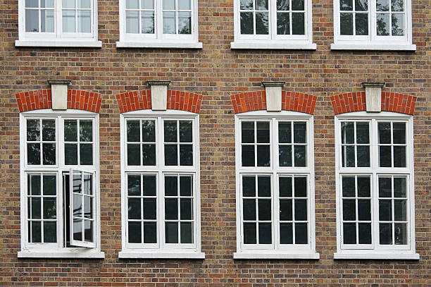 istock White window in the brick house 517725073