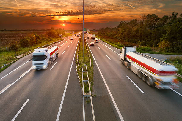 istock Two white trucks in motion blur on the highway 517726713